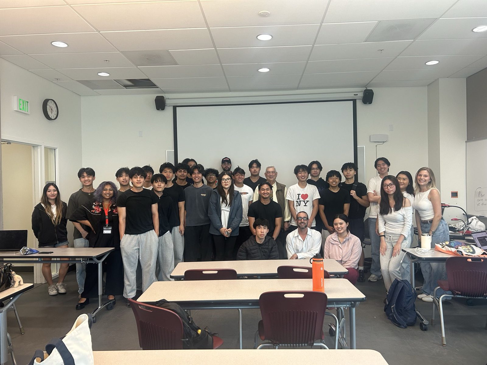 Group photo of ABG members and officers in front of the projector screen