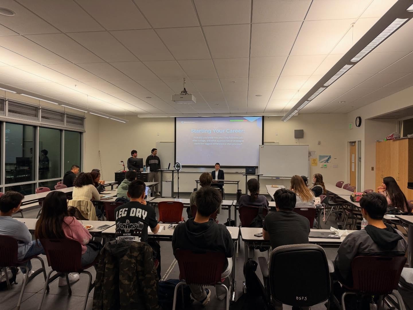 A full room of members during the panel
